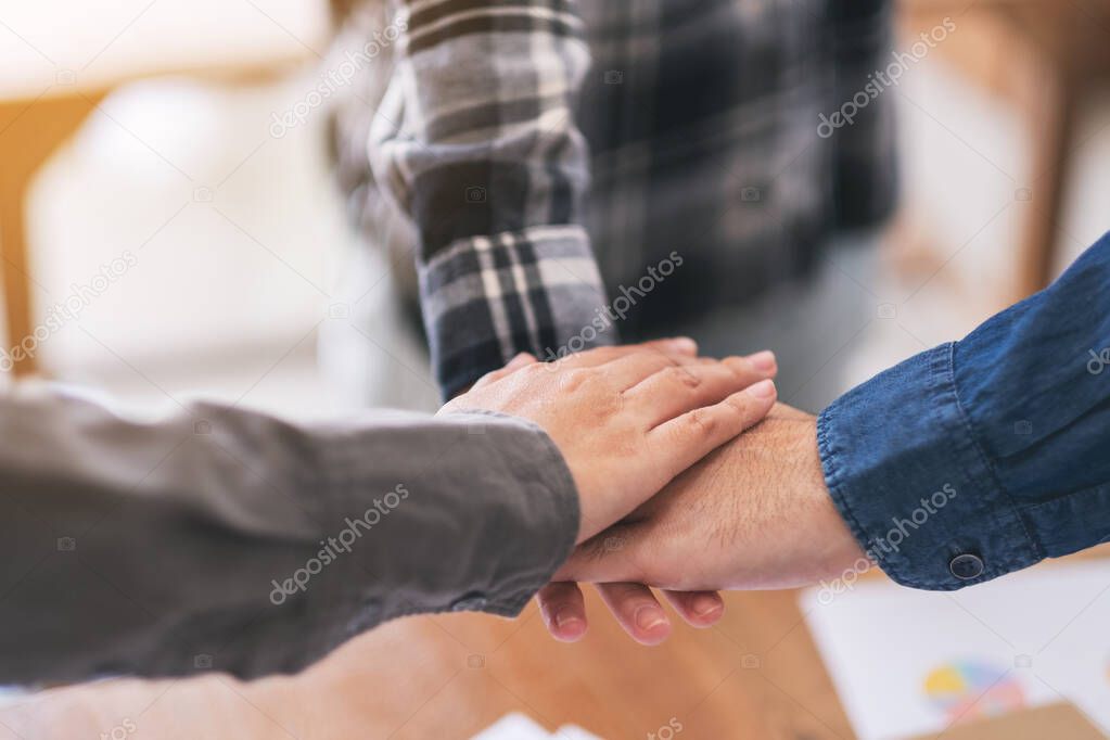 Businessman putting their hands together in the meeting