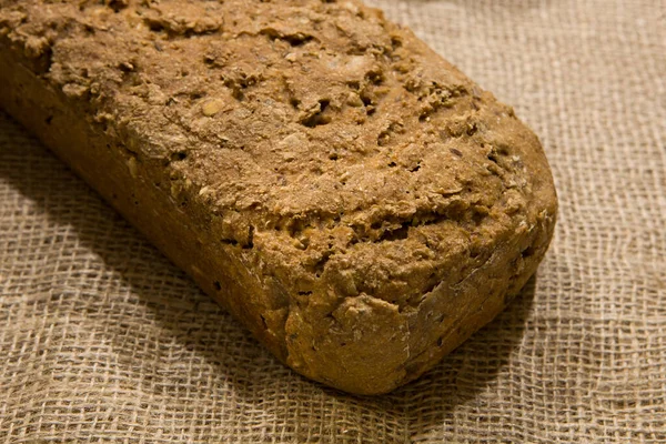 A healthy loaf of grain bread, homemade whole grain bread. Natural  homemade bread -  selective focus.