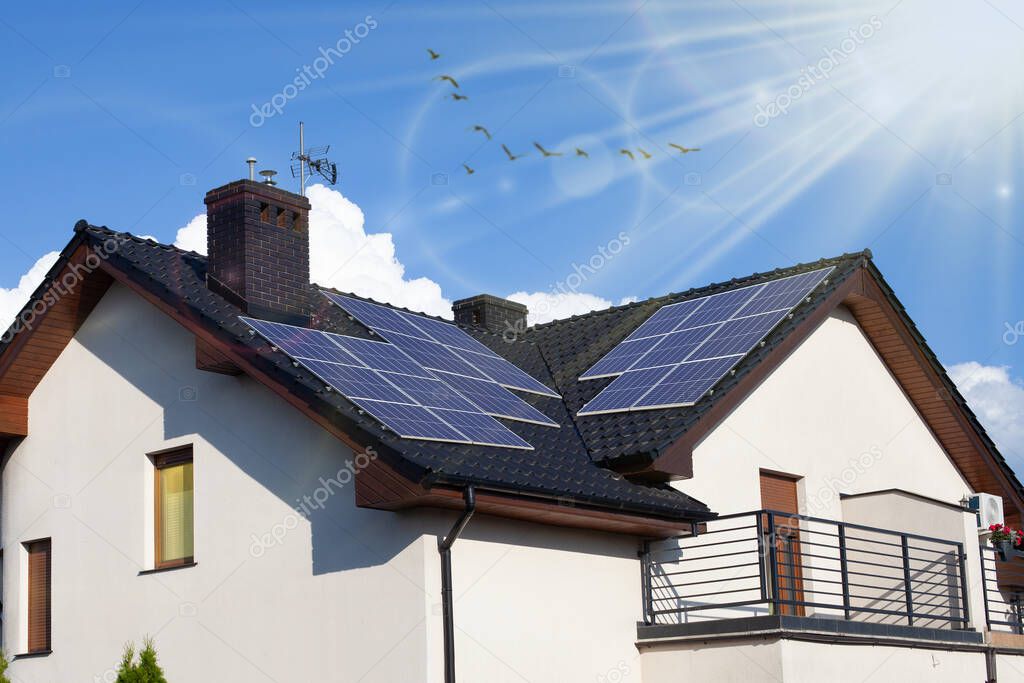 Modern House with Solar Panels on the Roof.