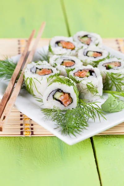 Uramaki sushi with cucumber, raw salmon and dill — Stock Photo, Image