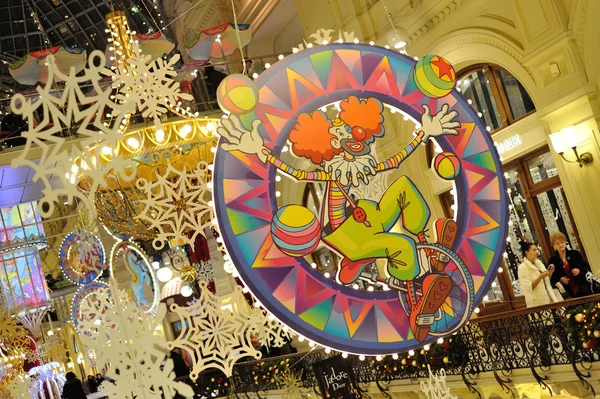 Drawn clown, snowflakes and Christmas illuminations in GUM store — Stock Photo, Image