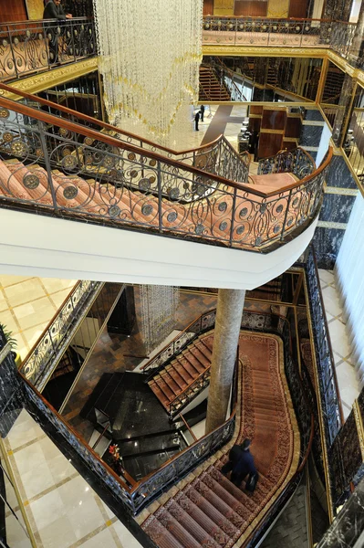 Hall, stairs and a large chandelier in hotel Lotte — Stock Photo, Image