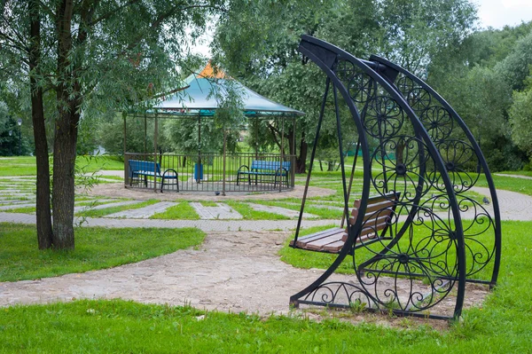 Metal swings and gazebo — Stock Photo, Image