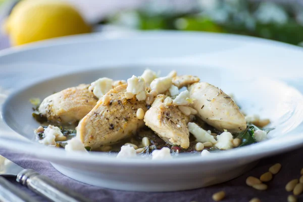Lemon Chicken with Sauteed Chard and Pine Nuts — Stock Photo, Image