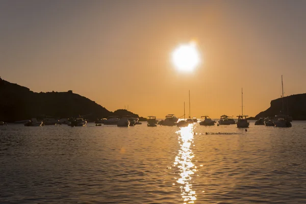 Sailboats in a harbor at sunset. Mediterranean sea of Ibiza island — Stock Photo, Image