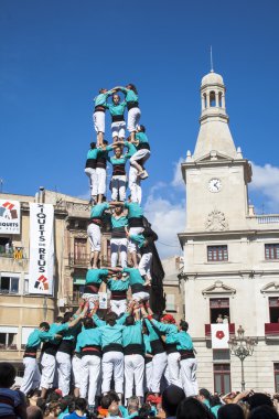 Human tower performed by castellers clipart