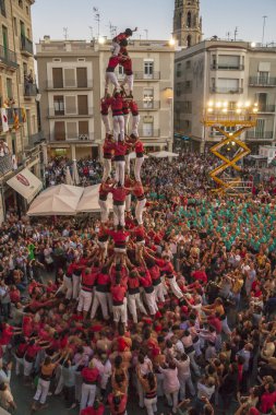 Reus, Spain - October 03, 2009: Castells Performance, a castell is a human tower built traditionally in festivals within Catalonia. This is also on the UNESCO Intangible Cultural Heritage of Humanity