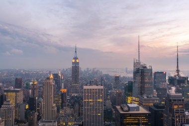 New York City skyline with urban skyscrapers at sunset clipart
