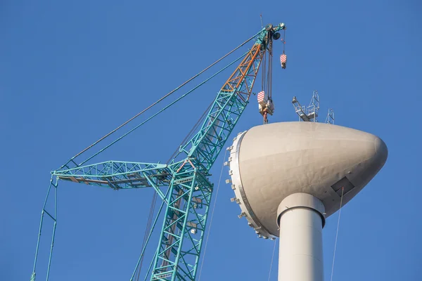 Construction site wind turbine with hoisting of rotor house — Stock Photo, Image
