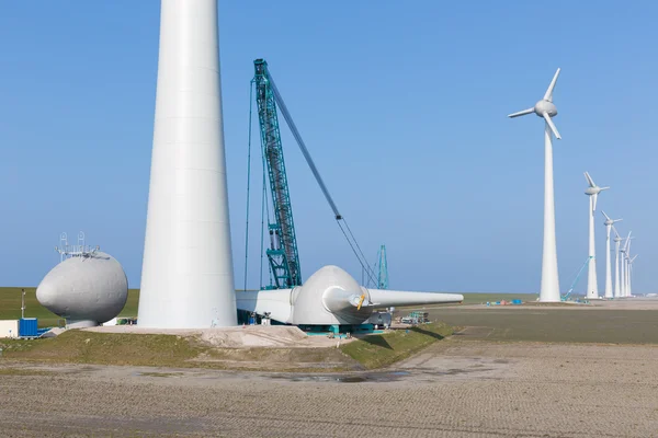 Dutch farmland with construction site ner wind turbines — Stock Photo, Image