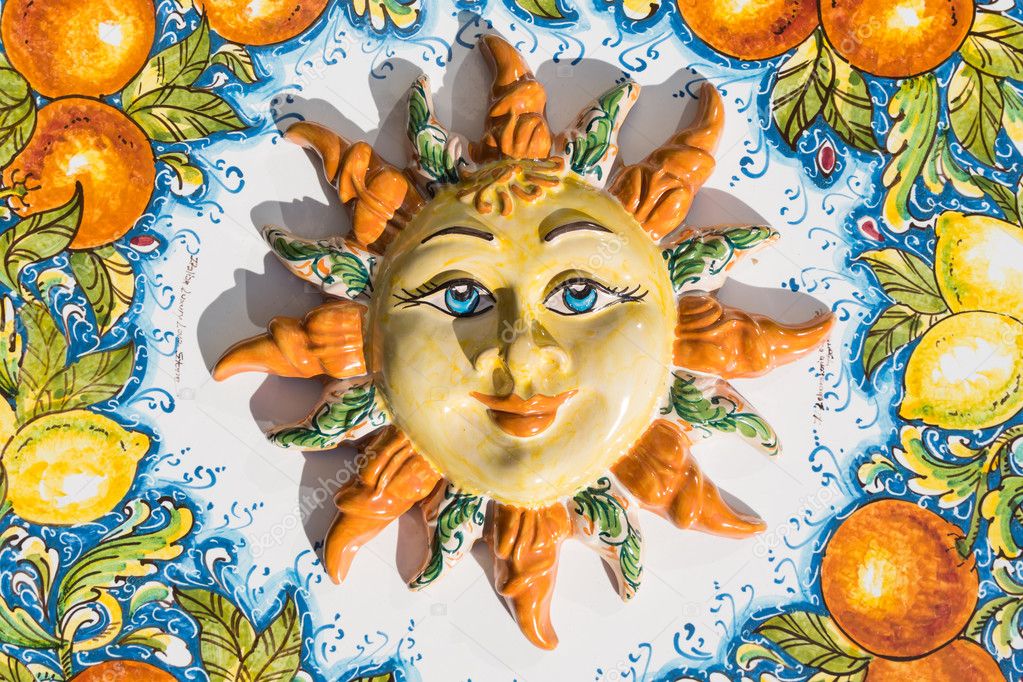 Sicilian sun face of ceramic in Taormina, Italy