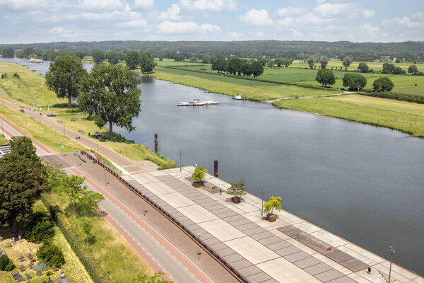 Aerial view Dutch village Cuijk along river Meuse