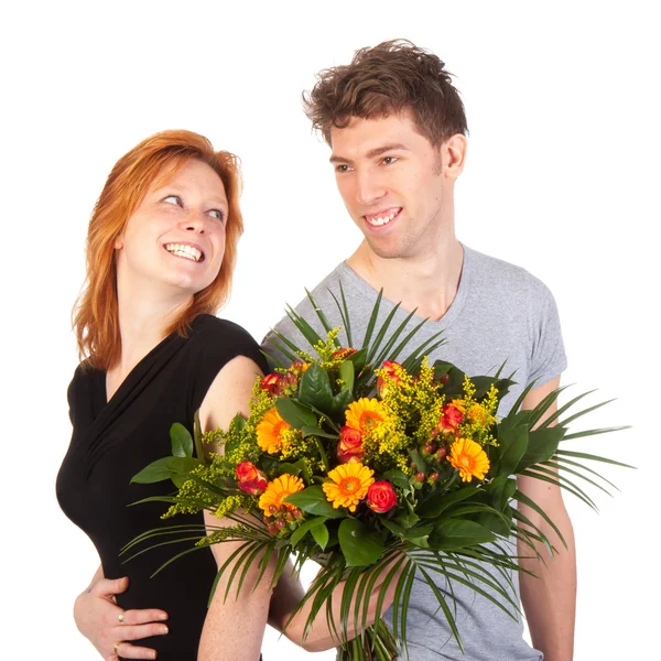 Man and woman standing backwards with a beautiful bunch of flowers — Stock Photo, Image