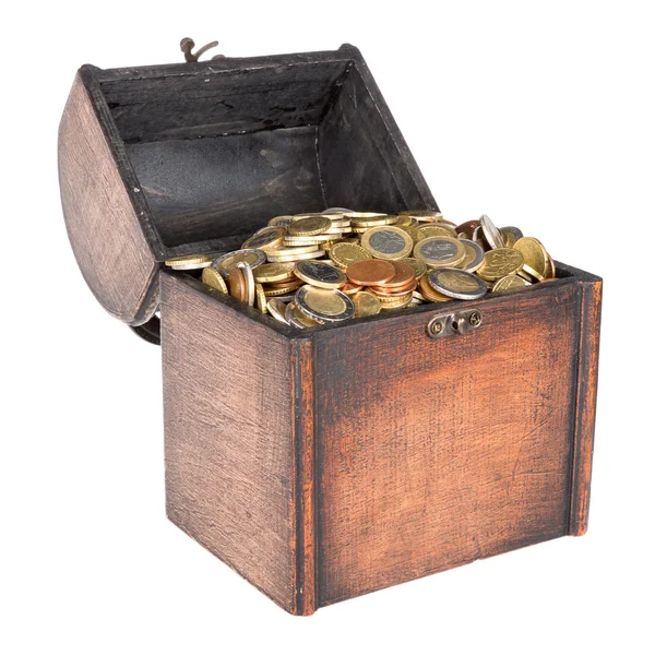 Wooden money chest filled with coins isolated over white — Stock Photo, Image