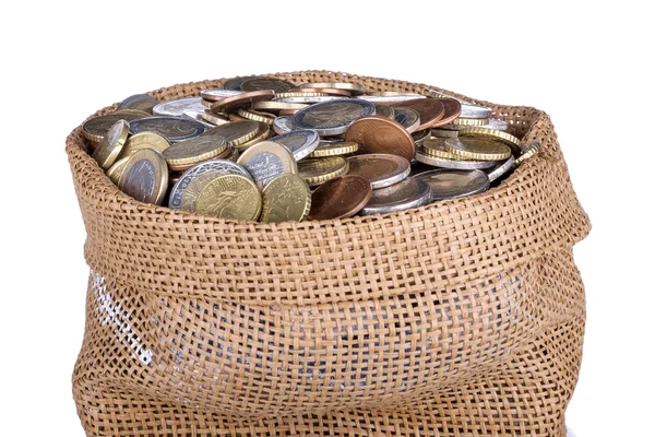 Geld tas met munten geïsoleerd op een witte achtergrond — Stockfoto