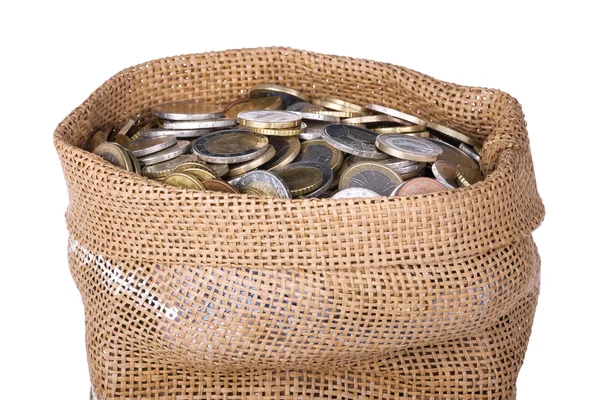 Geld tas met munten geïsoleerd op een witte achtergrond — Stockfoto