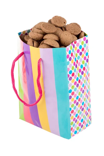 Kleurrijke zak gevuld met gember noten over Wit — Stockfoto