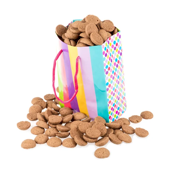 Colorful bag filled with ginger nuts over white Stock Image