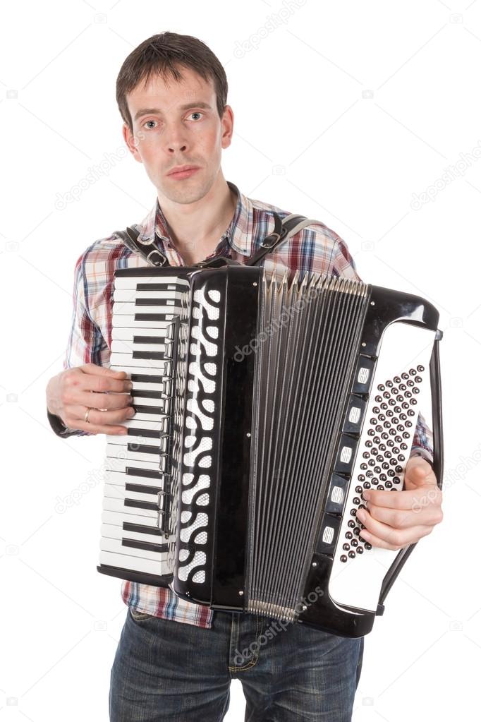 Man playing an accordion isolated over white