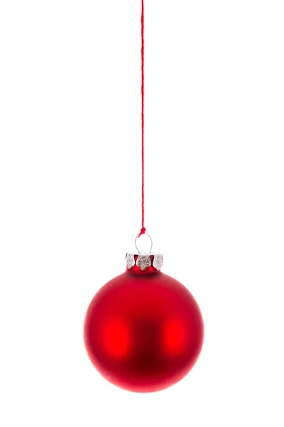 Red Christmas ball hanging at a rope over white — Stock Photo, Image