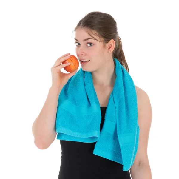 Wesoły fitness kobieta jedzenie czerwone jabłko — Zdjęcie stockowe