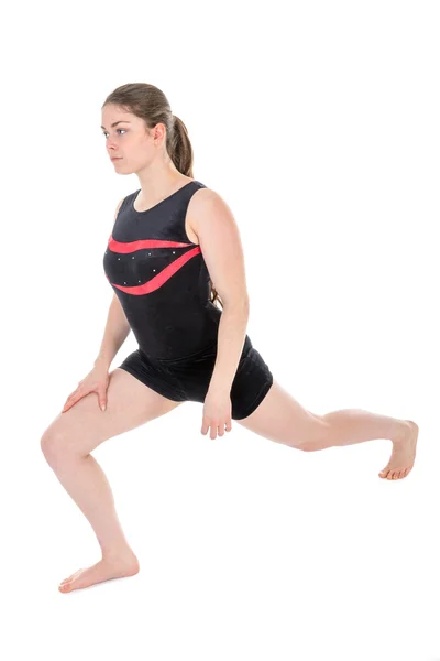 Young woman warming up for a gymnastics exercise. — Stock Photo, Image