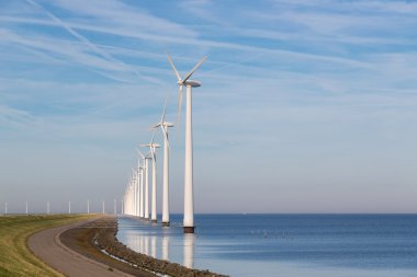 Long row off shore wind turbines in the Dutch sea clipart