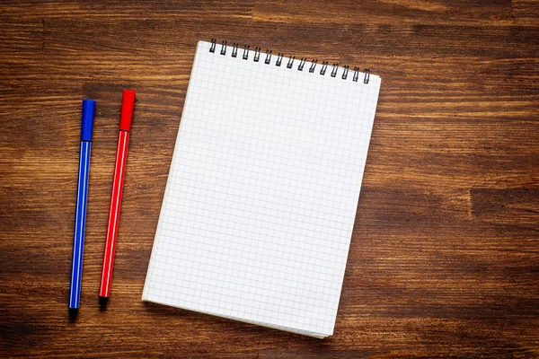 Notebook and pen on wood table — Stock Photo, Image