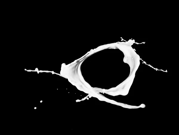 Milk splash isolated on black background — Stock Photo, Image