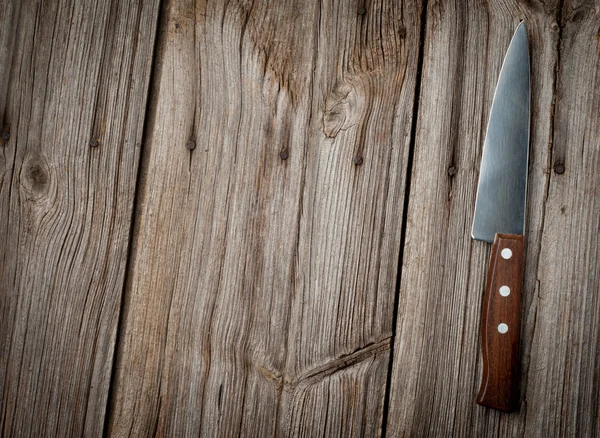 Knife on rustic kitchen table with copy space — Stock Photo, Image