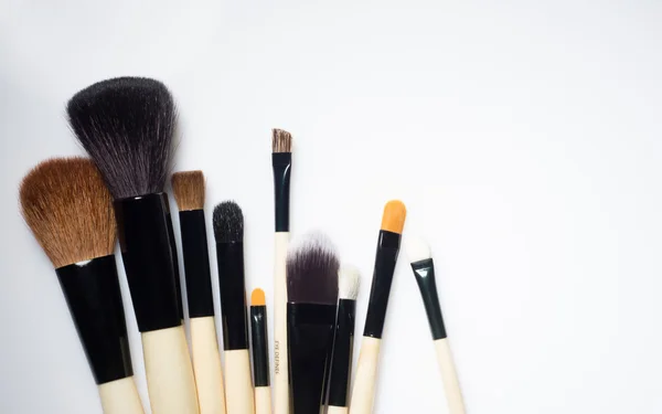 Make-up Brushes lying on white background — Stock Photo, Image