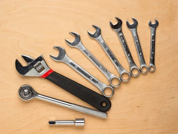 Set of tools on a wood panel — Stock Photo, Image