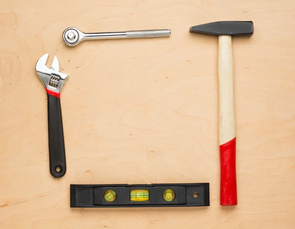 Set of tools on a wood panel — Stock Photo, Image