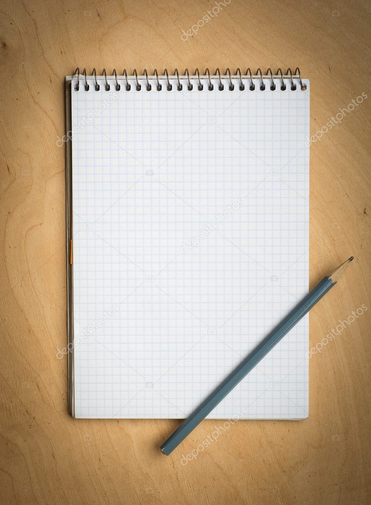 notebook with pencile on a wooden