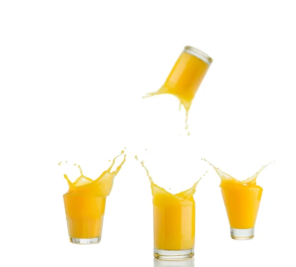 Suco de laranja conjunto espirrando isolado no branco — Fotografia de Stock