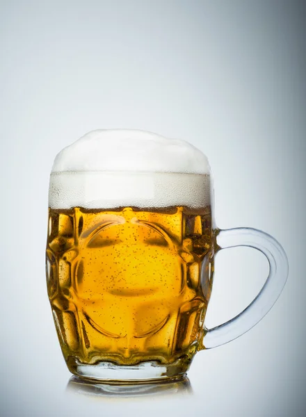 Mug full of fresh beer isolated on white — Stock Photo, Image