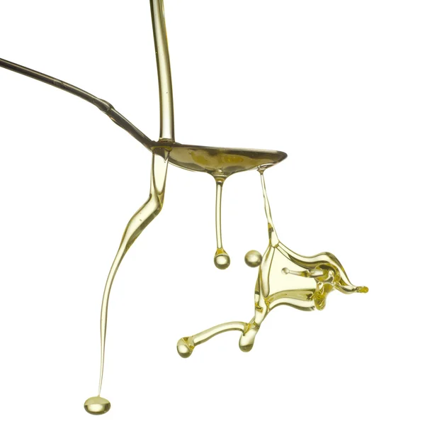 Pouring oil splash. Isolated on white background. — Stock Photo, Image