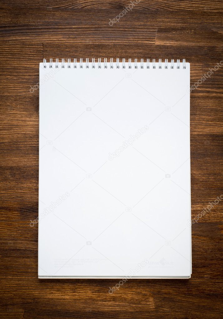 notebook with pencile on a wooden