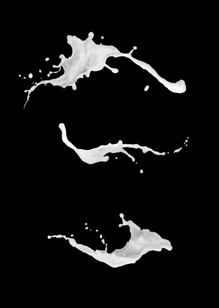 Coleção de salpicos de leite, isolado no fundo preto — Fotografia de Stock