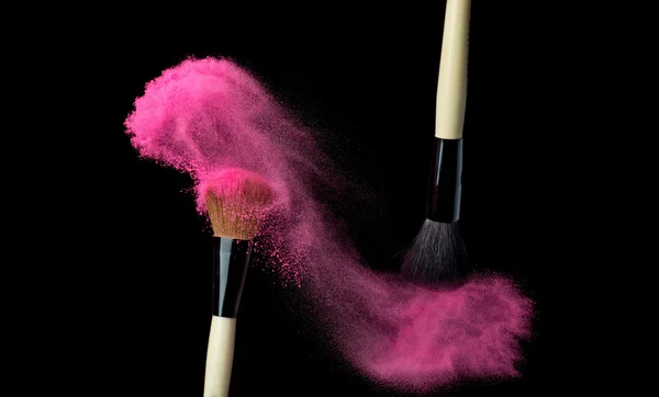 Powderbrush on black background with blue powder splash — Stock Photo, Image