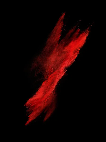 Congelar movimiento de explosión de polvo rojo aislado en negro — Foto de Stock