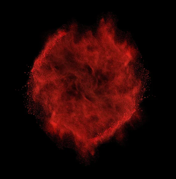 Freeze motion of red dust explosion isolated on black — Stock Photo, Image