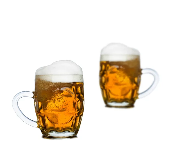 Mugs full of fresh beer isolated on white — Stock Photo, Image