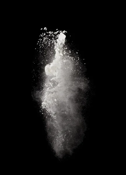 Freeze motion of white dust explosion isolated on black — Stock Photo, Image