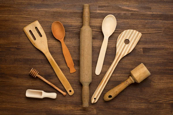 Wooden kitchen tools on vintage wooden background. — Stock Photo, Image