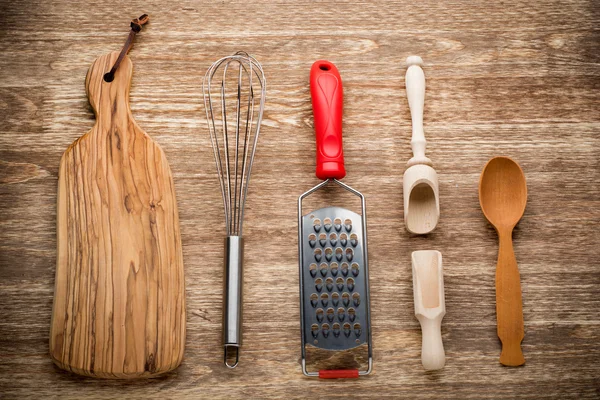 Rural kitchen utensils on vintage wood table from above - rustic background — Stock Photo, Image