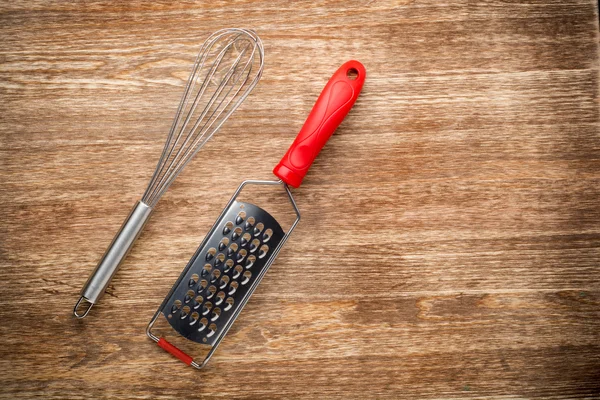 Rural kitchen utensils on vintage planked wood table from above - rustic background with free space — Stock Photo, Image