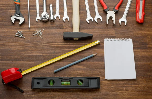 Set of tools over a wood panel with space for text — Stock Photo, Image