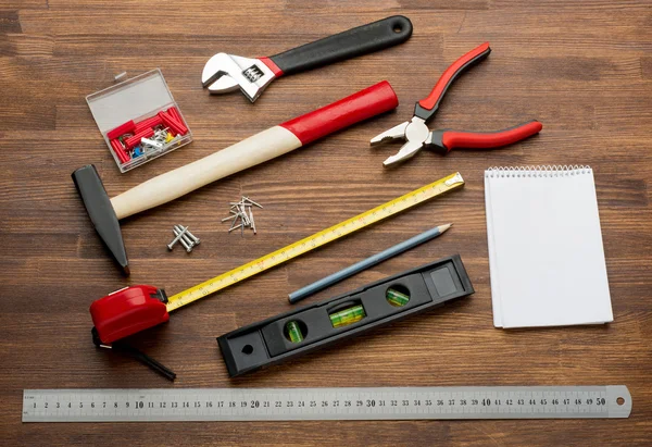 Set of tools over a wood panel with space for text — Stock Photo, Image