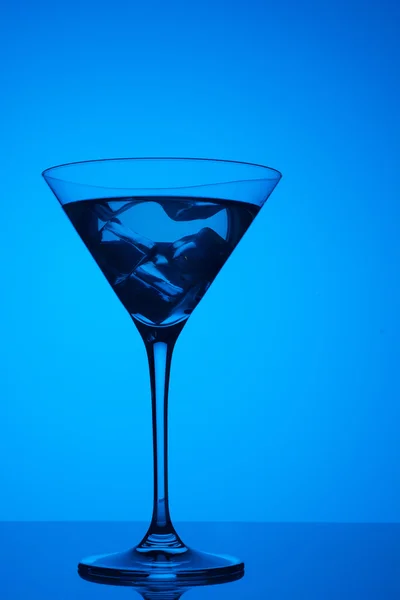 Colourful coctail with ice on the blue background — Stock Photo, Image